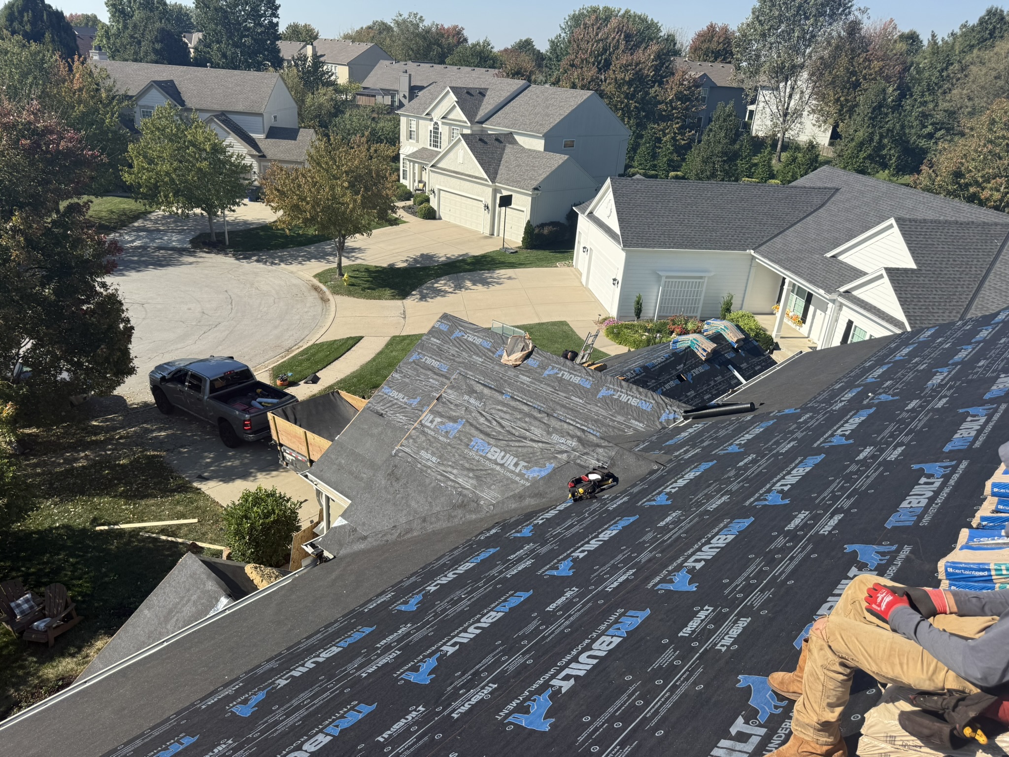 Aerial view of roof with new underlayment installed in an Olathe Kansas neighborhood